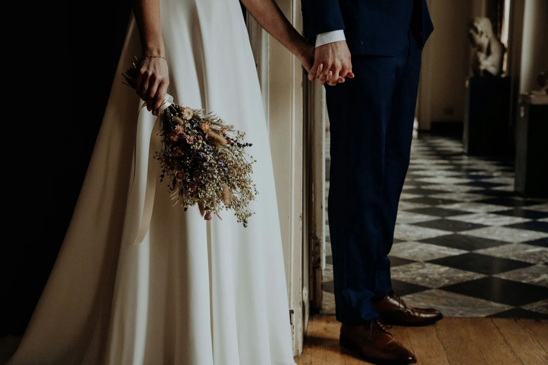 Outdoor wedding ceremony with floral arrangements and rows of chairs
